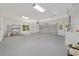 Spacious two car garage features a window, painted floor, and an automatic garage door opener at 8498 Sw 129Th Terrace Rd, Dunnellon, FL 34432