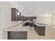 Modern kitchen with granite countertops, stainless steel appliances, and custom cabinetry at 8498 Sw 129Th Terrace Rd, Dunnellon, FL 34432