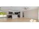 Bright, open-concept living space with tile floors and view to the backyard at 8498 Sw 129Th Terrace Rd, Dunnellon, FL 34432