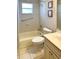 Cozy bathroom with a shower and tub combination, tiled walls, and a vanity with a sink at 9314 Sw 90Th St, Ocala, FL 34481