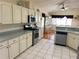 Well-equipped kitchen with stainless steel appliances, tile flooring, and plenty of counter space at 9314 Sw 90Th St, Ocala, FL 34481