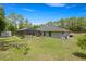 Exterior of home with screened in pool and shed in the backyard at 9835 Sw 207Th Cir, Dunnellon, FL 34431