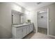 Bathroom with granite countertops, double sinks, and walk in closet at 9835 Sw 207Th Cir, Dunnellon, FL 34431