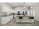 Modern kitchen with white cabinets, granite countertops, and stainless steel appliances creates a stylish cooking space at 9835 Sw 207Th Cir, Dunnellon, FL 34431