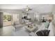 Open-concept living space featuring modern furnishings, with kitchen and dining areas in the background at 9835 Sw 207Th Cir, Dunnellon, FL 34431
