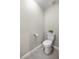 Clean, efficient toilet in neutral powder room with tiled floors and fresh neutral paint at 9835 Sw 207Th Cir, Dunnellon, FL 34431