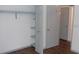 Closet featuring built-in shelving, and a bar perfect for storage and organization at 9880 Sw 101St Pl, Ocala, FL 34481