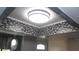 Modern kitchen ceiling with tile accents and a contemporary light fixture adds character to the space at 9880 Sw 101St Pl, Ocala, FL 34481