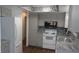 Updated kitchen featuring stainless steel appliances, granite countertops, and mosaic tile backsplash at 9880 Sw 101St Pl, Ocala, FL 34481