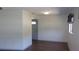 Living room with wood flooring, neutral paint, and a front door at 9880 Sw 101St Pl, Ocala, FL 34481