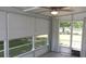 Enclosed patio featuring windows and views to the exterior at 9880 Sw 101St Pl, Ocala, FL 34481