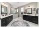 Bathroom featuring double sink vanities and a walk-in shower with glass surround at 10082 Sw 82Nd Place Rd, Ocala, FL 34481