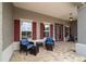 Charming front porch with brick floor and stylish outdoor seating area at 10082 Sw 82Nd Place Rd, Ocala, FL 34481