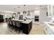 Stunning eat-in kitchen with stainless steel appliances, oversized island, and sleek modern design at 10082 Sw 82Nd Place Rd, Ocala, FL 34481