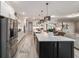 Gorgeous kitchen featuring a large island, stainless steel appliances, and modern finishes at 10082 Sw 82Nd Place Rd, Ocala, FL 34481