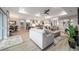 Spacious open-concept home featuring living room, dining area, and kitchen with modern appliances at 10082 Sw 82Nd Place Rd, Ocala, FL 34481