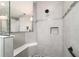 Shower with gray tiled walls, a built-in shelf and a bench seat at 10082 Sw 82Nd Place Rd, Ocala, FL 34481