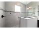 Stylish shower features gray tile, decorative accent tiles, frameless glass, and modern fixtures at 10082 Sw 82Nd Place Rd, Ocala, FL 34481