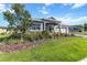 Well-kept home with a green lawn and mature trees in a peaceful neighborhood at 10327 Sw 96Th Loop, Ocala, FL 34481