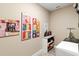 Laundry room featuring art decorated walls, a counter, shelves, and laundry machine at 10327 Sw 96Th Loop, Ocala, FL 34481