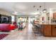 Spacious open-concept design seamlessly connects the living and dining area with the kitchen island at 10327 Sw 96Th Loop, Ocala, FL 34481