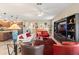 Open-concept living space with stylish furnishings, modern decor, and seamless flow to the kitchen at 10327 Sw 96Th Loop, Ocala, FL 34481
