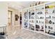 Bright living room featuring custom built-in shelving, creating ample display and storage space at 10327 Sw 96Th Loop, Ocala, FL 34481