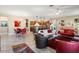 Bright and airy living area with comfortable seating, modern decor, and a seamless transition to the dining room at 10327 Sw 96Th Loop, Ocala, FL 34481