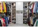 Walk-in closet featuring ample shelving and hanging storage for clothes and accessories at 10327 Sw 96Th Loop, Ocala, FL 34481