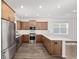Modern kitchen with stainless steel appliances, sleek countertops, and ample cabinet space for storage at 10347 Sw 99Th Ln, Ocala, FL 34481