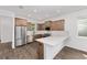 Modern kitchen with stainless steel appliances, sleek countertops, and ample cabinet space for storage at 10347 Sw 99Th Ln, Ocala, FL 34481