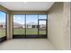 Covered lanai overlooking the backyard, perfect for relaxing outdoors at 10347 Sw 99Th Ln, Ocala, FL 34481