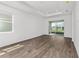 Bright living area showcasing a sliding glass door with a view of the backyard at 10347 Sw 99Th Ln, Ocala, FL 34481