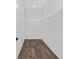 A walk-in closet with wood-look flooring and wire shelving at 10347 Sw 99Th Ln, Ocala, FL 34481