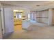 Cozy living room with open layout into kitchen with tile floor and eat-in breakfast bar at 11025 Sw 64Th Ave, Ocala, FL 34476
