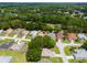 Drone shot of houses with solar panels nestled within a lush, green residential community at 11146 Sw 68Th Ct, Ocala, FL 34476