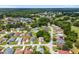 Aerial shot displays neighborhood homes, a pond, a community center, and lush greenery at 11146 Sw 68Th Ct, Ocala, FL 34476