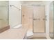 Bathroom featuring a vanity with granite countertop, a glass enclosed shower and a toilet at 11146 Sw 68Th Ct, Ocala, FL 34476