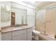 Bathroom featuring a vanity with granite countertop, a glass enclosed shower, and a toilet at 11146 Sw 68Th Ct, Ocala, FL 34476