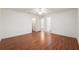 Spacious bedroom featuring hardwood floors, a ceiling fan, and multiple entry doors at 11146 Sw 68Th Ct, Ocala, FL 34476