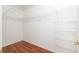Well-organized closet with wood floors and wire shelving for maximum storage at 11146 Sw 68Th Ct, Ocala, FL 34476