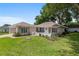 Charming home with brick paved driveway, lush lawn, and manicured landscaping at 11146 Sw 68Th Ct, Ocala, FL 34476
