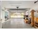 Spacious garage with an open door and exterior view, featuring ample storage and a clean concrete floor at 11146 Sw 68Th Ct, Ocala, FL 34476