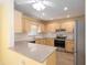 Well-lit kitchen featuring modern appliances, granite countertops, and ample cabinet space at 11146 Sw 68Th Ct, Ocala, FL 34476