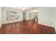 Bright living room featuring a ceiling fan and beautiful hardwood flooring at 11146 Sw 68Th Ct, Ocala, FL 34476
