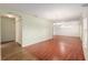 Spacious living room with sleek wood floors and a light and airy feel at 11146 Sw 68Th Ct, Ocala, FL 34476