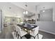 Open-concept dining room and kitchen area with modern furnishings and decor at 12720 Sw 73Rd Street, Ocala, FL 34481