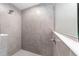 A tiled walk-in shower with a showerhead and handheld sprayer offers a relaxing washing space at 12720 Sw 73Rd Street, Ocala, FL 34481