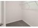 A walk-in closet with white wire shelving and gray carpet at 15095 Sw 35Th Cir, Ocala, FL 34473