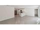 Open concept living area with tile floor, an island kitchen and stainless steel appliances at 15095 Sw 35Th Cir, Ocala, FL 34473